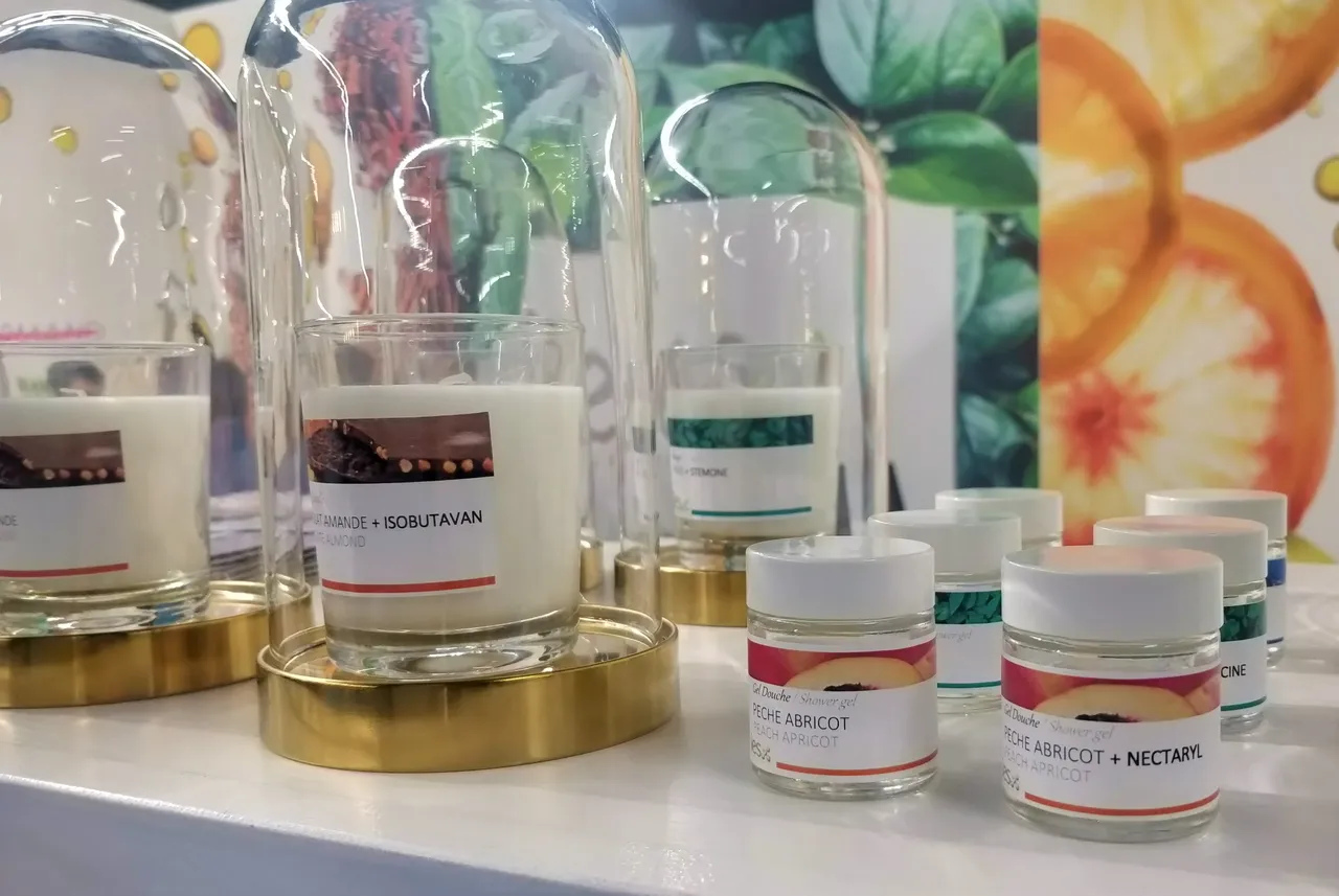 Natural cosmetics ingredients under glass domes: almond, isobutavan, peach apricot, nectaryl